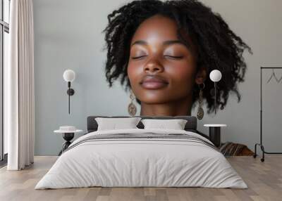 serene portrait of young black woman in meditative pose against white background graceful hand gesture and peaceful expression embody mindfulness and inner harmony Wall mural