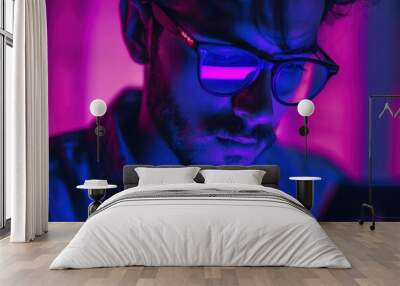 stylized portrait of a man using a smartphone bathed in vibrant purple light emphasizing the connection between humanity and technology Wall mural