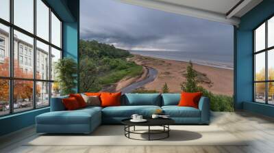 View to the baltic sea and Incupe river from Saulkrasti white dune, Latvia on rainy day Wall mural