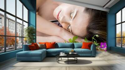 The woman with a natural make-up relaxed and fell asleep outdoors Wall mural