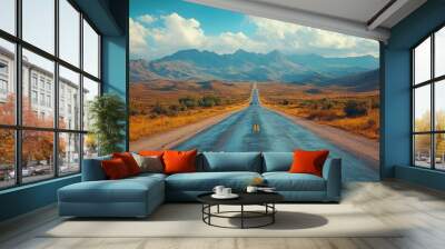 A scenic road stretches into the mountains under a bright sky. Wall mural