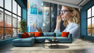 Businesswoman Analyzing Data on Interactive Screen Wall mural