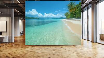 Serene beach with clear waters and lush greenery under blue skies. Wall mural