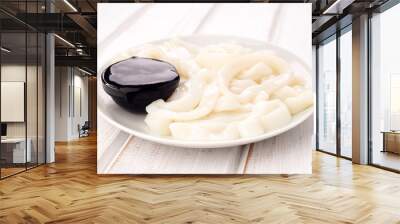 plate with ink squid rings and concentrated Wall mural