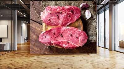 uncooked horse meat steaks on rustic wooden board Wall mural