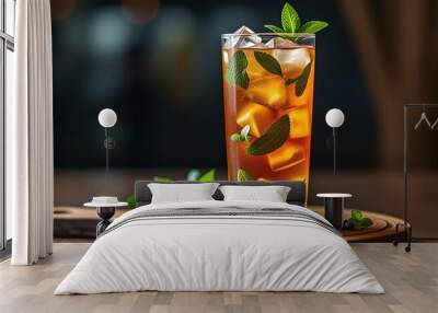 A refreshing iced tea drink garnished with mint leaves Wall mural