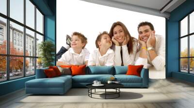 Casual portrait of a healthy, attractive young family  Wall mural