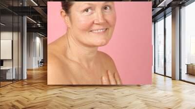 Soft and intimate portrait of a naturally beautiful older woman Wall mural