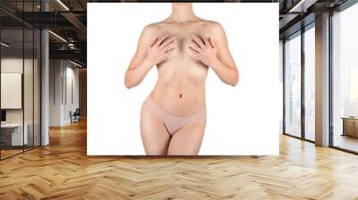 Female fit cropped body in skin color panties, isolated on white. Woman cover her bust by her hands. Wall mural