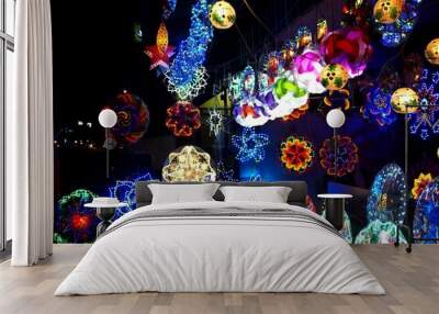 Colorful Christmas lanterns on display at a store Wall mural