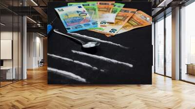 cocaine lines with syringe and spoon, bag full of heroin on black background and pile of euro money. stop drugs and addiction Wall mural