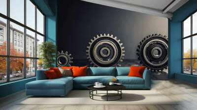 Dark Industrial Composition Featuring Three Metal Gears in Varying Sizes on Wooden Surface Wall mural