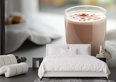 A glass of hot chocolate with foam sprinkled with chocolate chips Wall mural