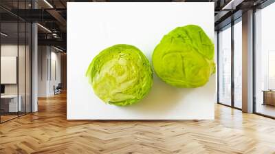 two cut brussel sprouts sit next to each other Wall mural