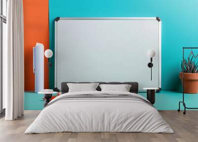 A white board sits on a table with a green and orange background Wall mural