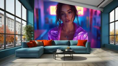 Female model, wearing a pink and purple tracksuit, standing in a dark blue room with neon lights. The image has a high-fashion style.  Wall mural