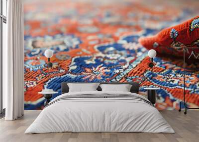 Persian carpet with vibrant red and blue, closeup, intricate patterns Wall mural