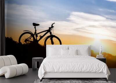 Mountain bike on the background of sunset. Wall mural