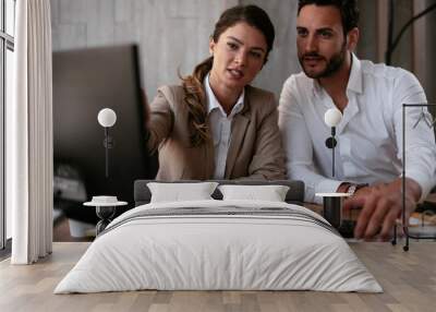 Businessman and businesswoman in office. Businesswoman and businessman working on the project Wall mural