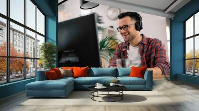 Businessman on video call. Handsome man in office with headphones.  Wall mural