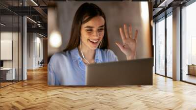 Businesswoman in having a video call on laptop. Wall mural