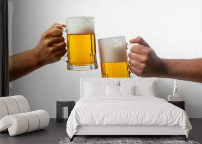 Hands toasting with beer on white background Wall mural