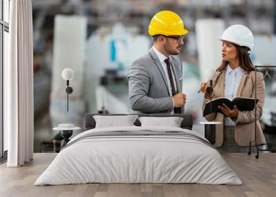 Man and woman discussing work Wall mural