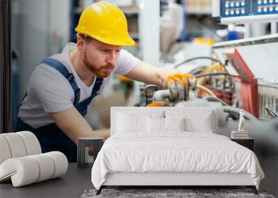 Portrait of man working in factory Wall mural