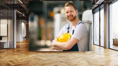 Portrait of worker in factory. Wall mural