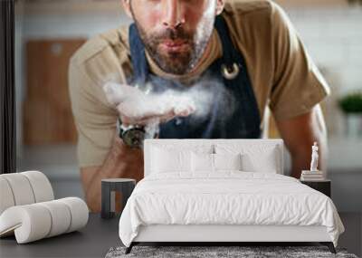 Young man preparing bread at home. Happy man having fun while baking a fresh pasta Wall mural