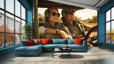 A young couple lounging in a jeep as they tour the safari matching binoculars in hand. Wall mural