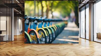 Closeup of a bikesharing station with bright colored bicycles lined up in perfect rows. Wall mural