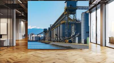 The unmistakable scent of freshly processed grain permeating the air as it is loaded and unloaded at the bustling port facility. Wall mural