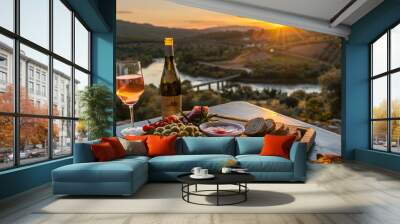 You take in the stunning view of the sunset over the river sipping on a glass of cold crisp rosé and nibbling on a savory picnic of cured meats olives and crusty bread. Wall mural