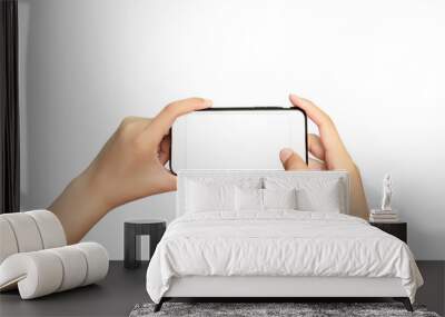 Women's hand holding a smartphone with a blank screen, isolated on a white background Modern smartphone Wall mural