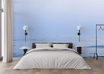 two boats in the sea. This picture is a blue tone. Wall mural