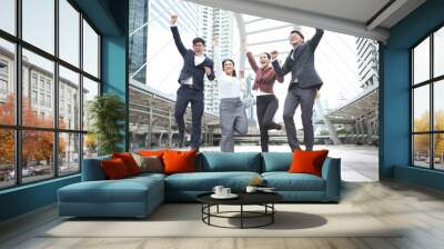 Group of happy business people is jumping. Wall mural