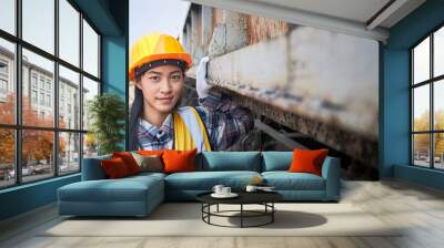 Portrait of a female train maintenance engineer. Wall mural