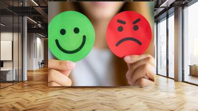 Customer giving rating and review with happy or sad face icons by choosing green happy face. Customer satisfaction, evaluation, service quality online rating concept. Wall mural