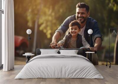 Father teaching his son cycling at park Wall mural