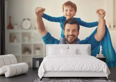 Superhero Dad, happy father and son playing super hero game at home, concept of Father's Day, family, love. Wall mural