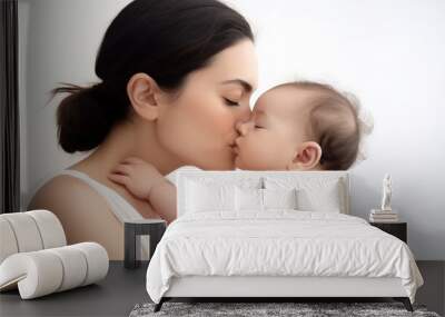 Young loving mom kissing her new born baby isolated on white background. Wall mural