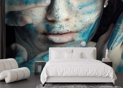 Beautiful model with creative makeup art. Caucasian girl with painted face in blue white flowers Wall mural