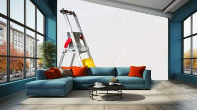 Ladder in front of a white wall Wall mural