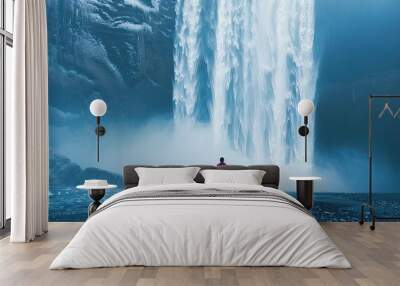 Waterfall , beautiful landscape with waterfall and man standing under the water splash Wall mural