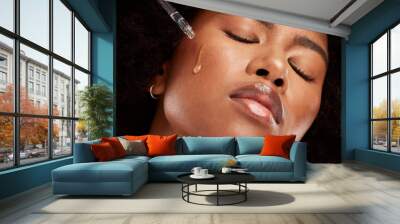 Face, skincare and black woman with pipette serum for healthy skin. Wellness, beauty and young model from Nigeria with hyaluronic oil dropper for flawless skin, moisturizing or facial treatment. Wall mural