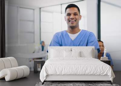 Face, healthcare and insurance with a nurse man standing arms crossed in a hospital for medical treatment. Portrait, doctor and trust with a male medicine professional in a clinic for diagnosis Wall mural