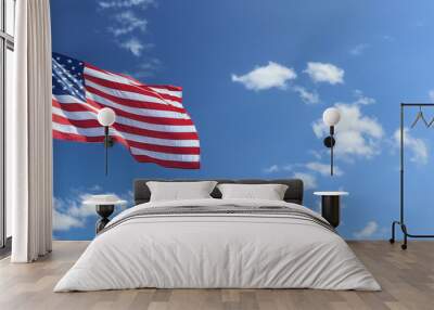 American flag on flag pole flying in the wind against blue sky with clouds  Wall mural