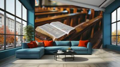 Bible on a wooden church pew in an empty church  Wall mural