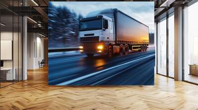 A large truck traveling swiftly on a winter road, showcasing speed and transport capabilities in a snowy landscape. Wall mural